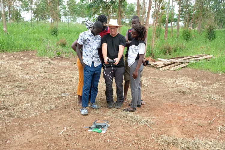 <p>Field drone training with staff and community in Uganda</p>